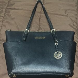 Black michael kors bag and wallet. Never used.